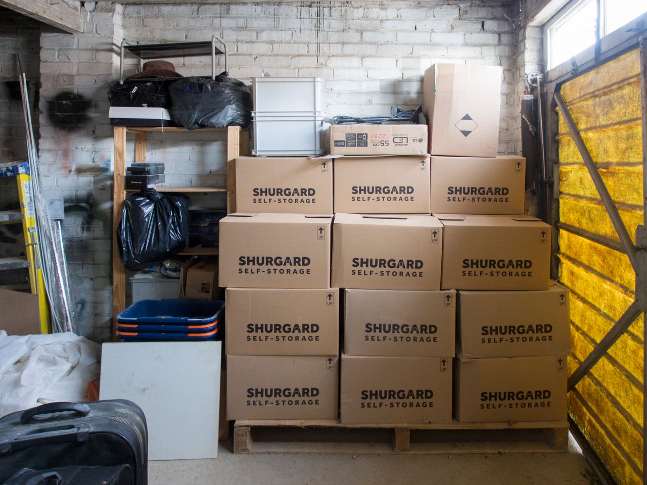 creative A stack of storage boxes in a well-organized warehouse interior.